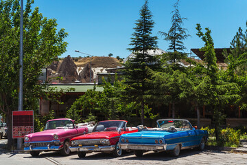 Retro cars in the parking lot in Cappadocia. American retro convertibles