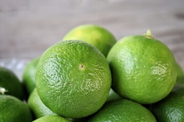 Green lime on wood background