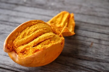 Canistel fruit on wood background