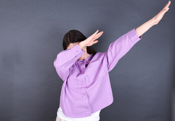 Photo of funky young beautiful Caucasian woman wearing pink shirt over studio grey wall show disco...