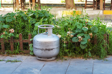 gas bottle on the road. danger of explosion in the street. liquefied gas in a bottle
