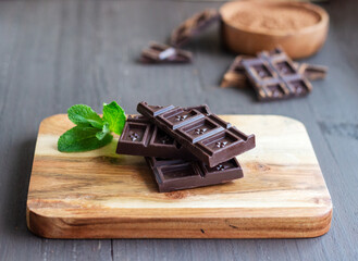 chocolate on the wooden board on the wooden background