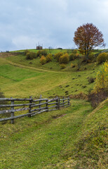 Cloudy and foggy day autumn mountains scene. Peaceful picturesque traveling, seasonal, nature and countryside beauty concept scene. Carpathian Mountains, Ukraine.