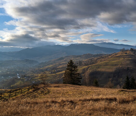 Last good weather days in autumn mountain countryside. Peaceful picturesque Ukrainian Carpathians mountains scene.