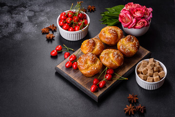 Fresh delicious rice flour muffins with cherries on a concrete background. Homemade pastries
