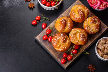 Fresh delicious rice flour muffins with cherries on a concrete background. Homemade pastries