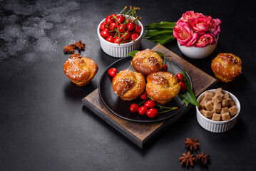 Fresh delicious rice flour muffins with cherries on a concrete background. Homemade pastries