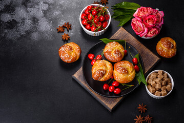 Fresh delicious rice flour muffins with cherries on a concrete background. Homemade pastries