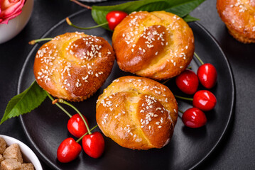 Fresh delicious rice flour muffins with cherries on a concrete background. Homemade pastries