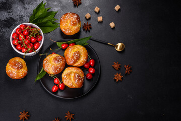 Fresh delicious rice flour muffins with cherries on a concrete background. Homemade pastries