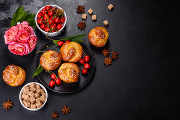 Fresh delicious rice flour muffins with cherries on a concrete background. Homemade pastries