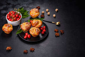 Fresh delicious rice flour muffins with cherries on a concrete background. Homemade pastries