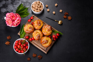 Fresh delicious rice flour muffins with cherries on a concrete background. Homemade pastries