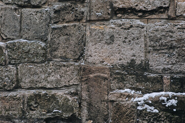 Texture of grunge stone wall. Natural surface. Background of old large gray sandstone and granite blocks.
