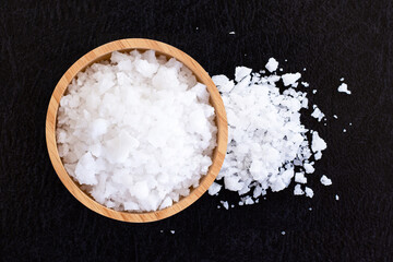 sea salt in bowl on a wooden table