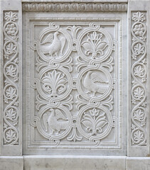 Marble stone carving with geometric, plant and bird motifs. Handmade. marble texture. Byzantine motifs in the decoration of Orthodox churches.