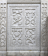 Marble stone carving with geometric, plant and bird motifs. Handmade. marble texture. Byzantine motifs in the decoration of Orthodox churches.