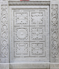 Marble stone carving with geometric, plant and bird motifs. Handmade. marble texture. Byzantine motifs in the decoration of Orthodox churches.