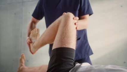 Close Up of a Sportsman Patient Undergoing Physical Therapy to Recover from Surgery and Increase Mobility. Physiotherapist Works on Specific Muscle Groups or Joints to Rehabilitate from Injury. - Powered by Adobe