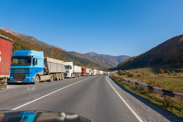 Trucks stuck on roadside in countryside - Powered by Adobe