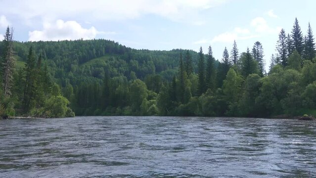 Middle Siberia, Krasnoyarsk Territory. Hilly (coniform hill) river bank, pour. Taiga mixed forests