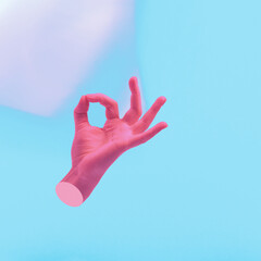 Female hand gesturing ok sing with fingers. Contemporary art collage, modern design. Aesthetic of hands. Pink and blue. Surreal conceptual poster.
