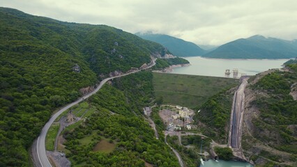 majestic aerial view of green mountains and Zhinvali Dam in distance, Caucasus, Georgia. High quality photo