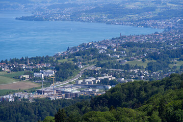 Aerial view of Lake Zürich and Canton Zürich with Lake Zürich in the background seen from local mountain Uetliberg on a sunny spring day. Photo taken May 18th, 2022, Zurich, Switzerland.