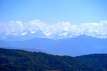 Aerial view of landscape at Canton Z&uuml;rich with the Swiss Alps in the background seen from local mountain Uetliberg on a sunny spring day. Photo taken May 18th, 2022, Zurich, Switzerland.