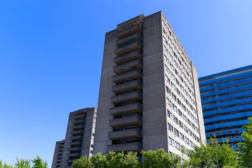 Obraz premium Concrete apartment towers of Triemli Hospital at City of Zürich on a sunny spring day. Photo taken May 18th, 2022, Zurich, Switzerland.