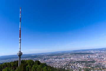 Aerial view of City of Zürich seen from local mountain Uetliberg with communications tower on a sunny spring day. Photo taken May 18th, 2022, Zurich, Switzerland.