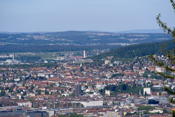 Fototapeta na wymiar Aerial view of City of Zürich seen from local mountain Uetliberg on a sunny spring day. Photo taken May 18th, 2022, Zurich, Switzerland.