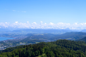 Aerial view of Lake Z&uuml;rich and Canton Z&uuml;rich with the Swiss Alps in the background seen from local mountain Uetliberg on a sunny spring day. Photo taken May 18th, 2022, Zurich, Switzerland.