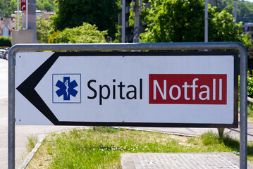 Sign with text Spital Notfall (Swiss German, translation is hospital emergency) to emergency room...