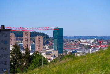 Skyline of City of Zürich with apartment towers and apartment towers on a sunny spring day. Photo taken May 18th, 2022, Zurich, Switzerland.