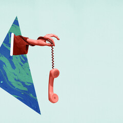 Colorful bright image of female hand holding old-fashioned pink colored phone, handset isolated over light background.