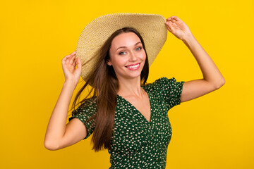 Photo of nice pretty lady arms touch sunhat toothy smile enjoy pastime isolated on yellow color background