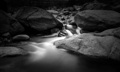 Water torrent and waterfall in the Atazar Reservoir, Madrid.