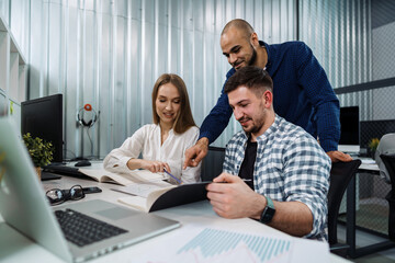 Group of young business people working in office