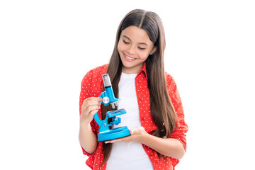 Teenager school girl with microscope. Back to school. Girl scientist isolated on white. Portrait of happy smiling teenage child girl.