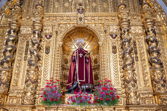 Trigueros, Huelva, Spain - April 17, 2022: Sculpture of San Antonio Abad (Saint Anthony Abbot),saint of trigueros, in its golden chapel