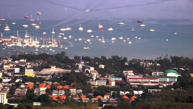 Many large and small yachts, sailboats and motor boats in the Bay at the pier. Sea voyages in the Andaman and South China seas. Aerial photos