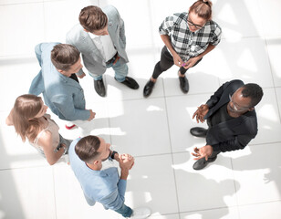 Fototapeta na wymiar Top view of diversity group working together on architectural project in office interior