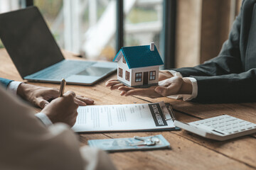 Real estate agents are carrying a housing model of the project to be forwarded to customers as home...