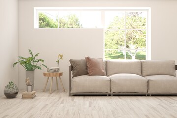 Fototapeta premium Minimalist living room in white color with sofa and summer landscape in window. Scandinavian interior design. 3D illustration