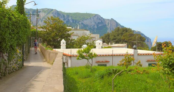 Scenery In Capri, Italy, Woman walking in the distance - panning