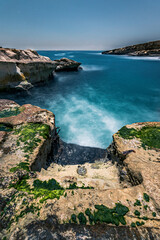 Fototapeta premium Access stairs to the famous beach of St. Peter's Pool, Marsaxlokk, Malta.