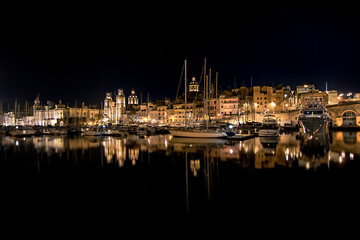 Silhouette and night reflections of the port of Valletta, Malta