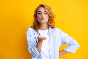 Lovely redhead woman with air kiss. Beautiful woman in love portrait. Air kiss.