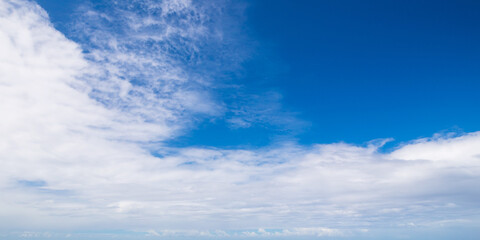 White clouds are in deep blue sky, natural texture